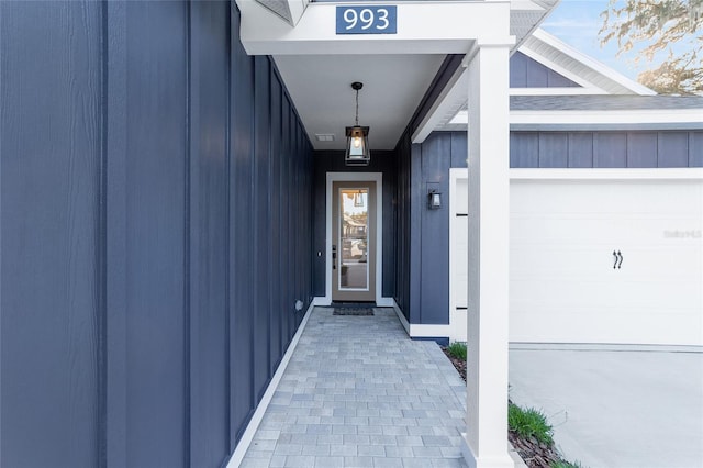 doorway to property featuring a garage