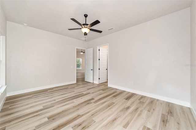 unfurnished room featuring ceiling fan and light hardwood / wood-style flooring