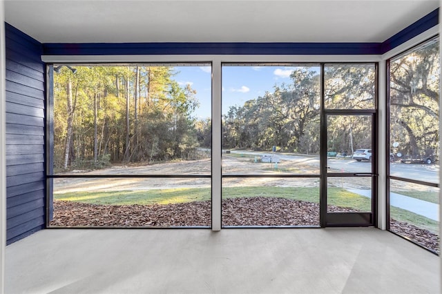 unfurnished sunroom featuring plenty of natural light