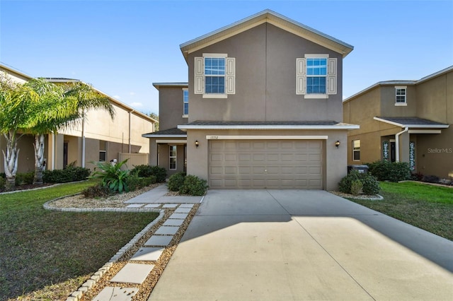 view of front of home featuring a garage and a front yard