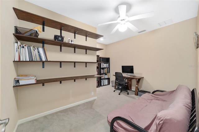 office with light carpet and ceiling fan