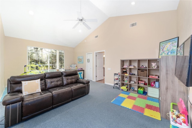 living room with carpet flooring, high vaulted ceiling, and ceiling fan