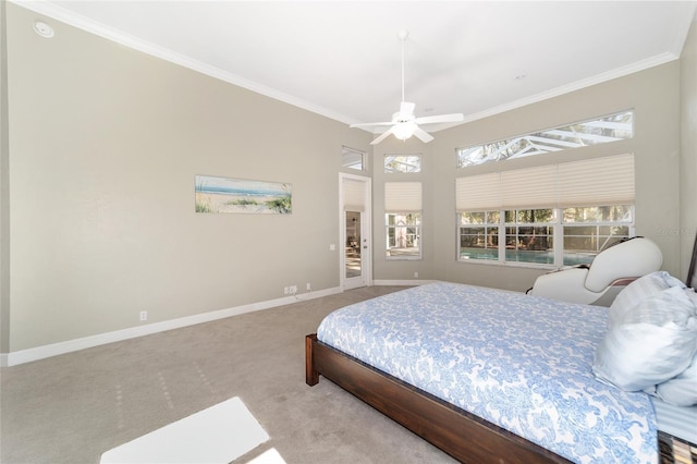 carpeted bedroom featuring ceiling fan and ornamental molding