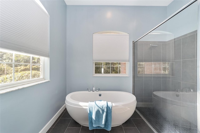 bathroom featuring tile patterned flooring and shower with separate bathtub