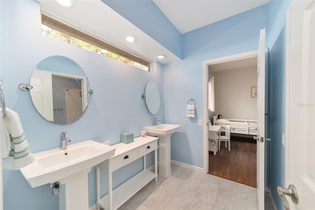 bathroom featuring tile patterned flooring and double sink