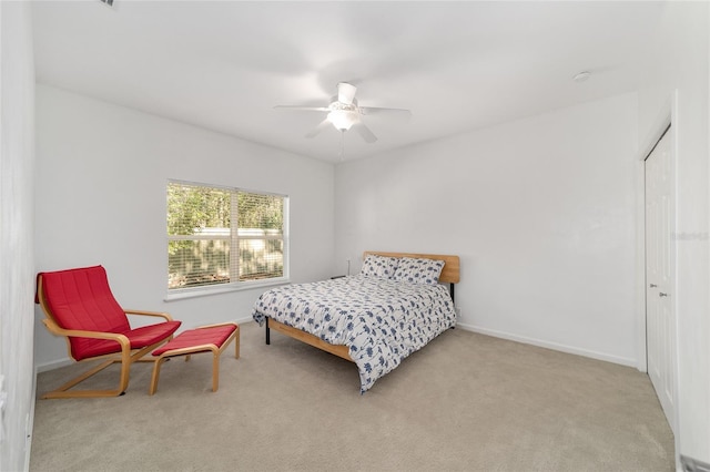 carpeted bedroom with ceiling fan