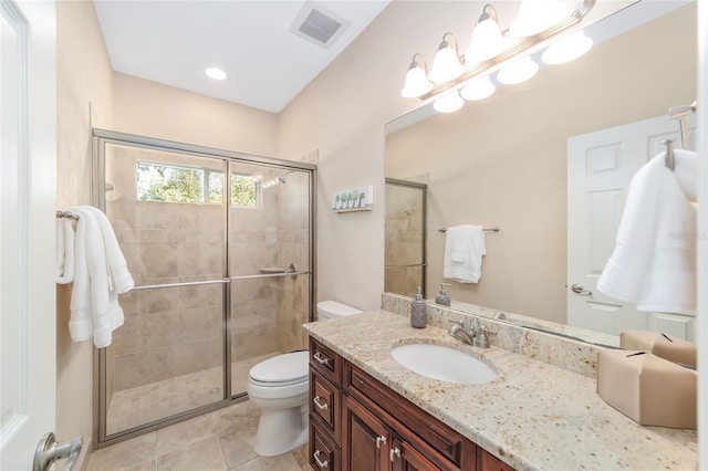 bathroom with vanity, toilet, and walk in shower