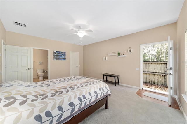 bedroom featuring ceiling fan, light carpet, and connected bathroom