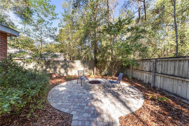 view of patio / terrace with an outdoor fire pit