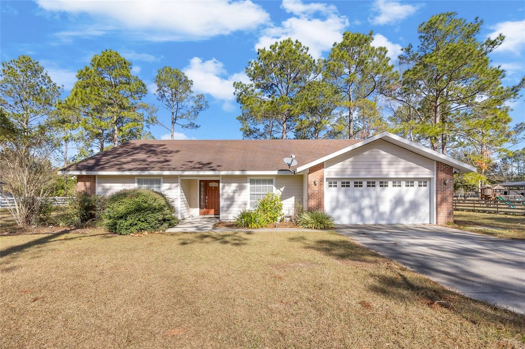 ranch-style house with a front lawn and a garage