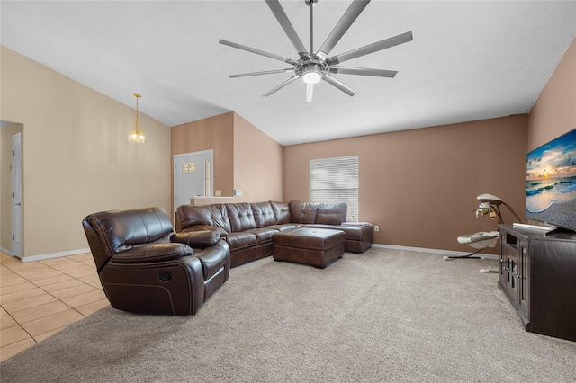 tiled living room featuring ceiling fan and lofted ceiling