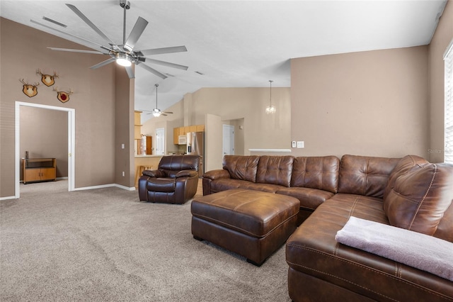 living room featuring light carpet, vaulted ceiling, and ceiling fan