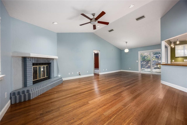 unfurnished living room with ceiling fan, a fireplace, wood-type flooring, and vaulted ceiling