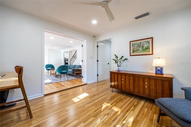 office with ceiling fan and light hardwood / wood-style floors