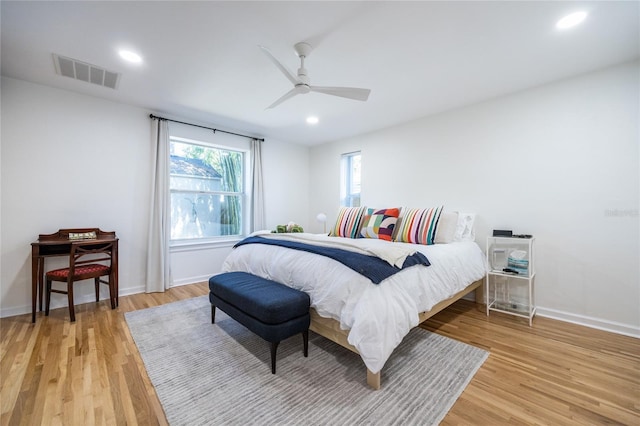 bedroom featuring hardwood / wood-style flooring and ceiling fan