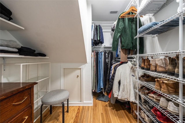 spacious closet featuring hardwood / wood-style flooring