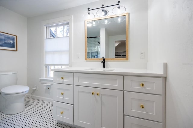 bathroom featuring vanity and toilet