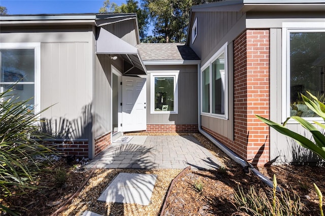 entrance to property with a patio