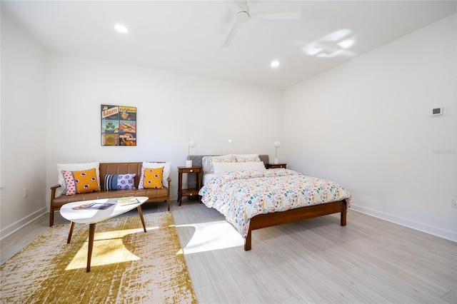 bedroom with light hardwood / wood-style floors and ceiling fan