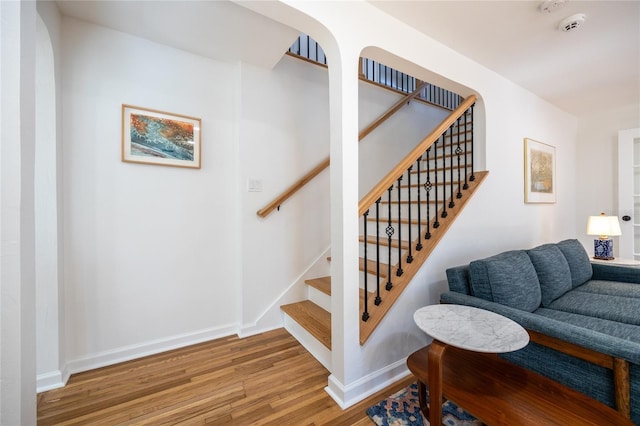 stairs with wood-type flooring