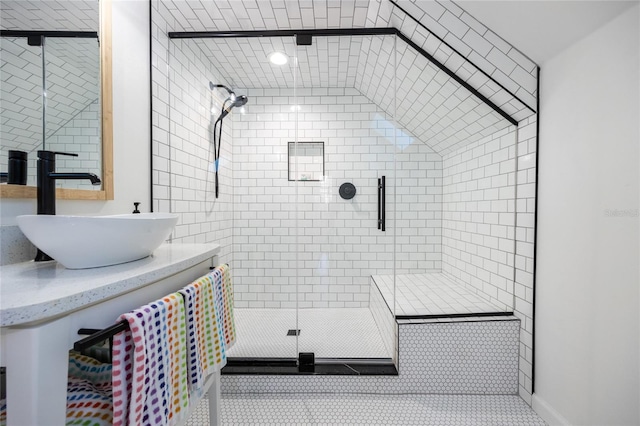 bathroom featuring tile patterned flooring, vanity, and walk in shower