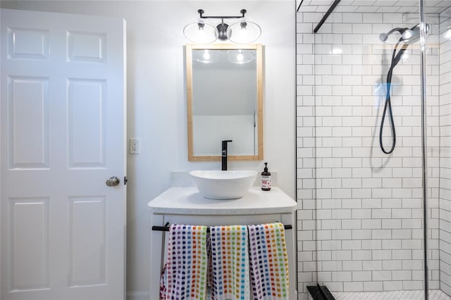 bathroom featuring vanity and a tile shower