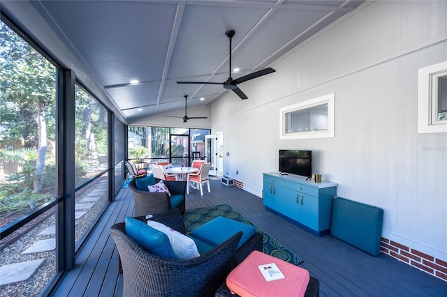 sunroom featuring vaulted ceiling and ceiling fan