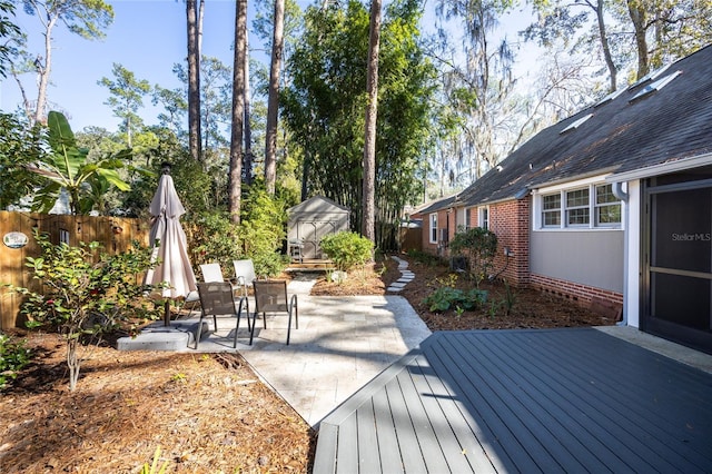 wooden deck with a patio area