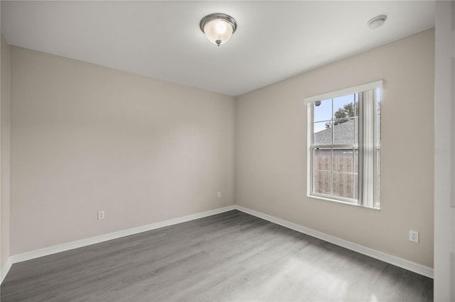 spare room featuring hardwood / wood-style floors