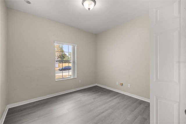 spare room with light wood-type flooring