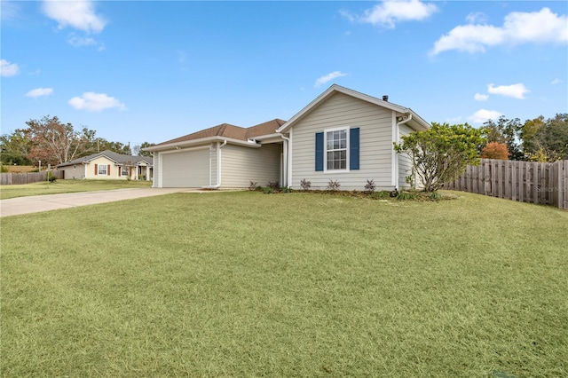 ranch-style home featuring a front yard and a garage