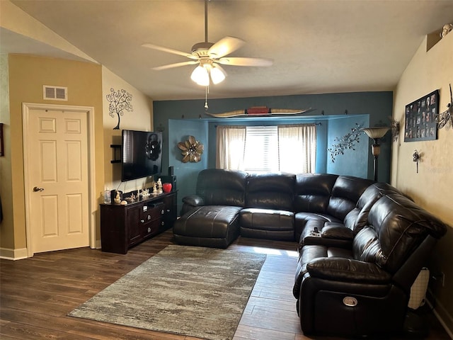 living room featuring ceiling fan, dark hardwood / wood-style flooring, and vaulted ceiling