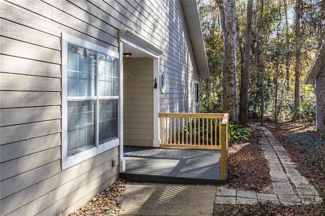 view of home's exterior with a wooden deck