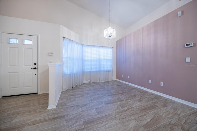 foyer entrance featuring a healthy amount of sunlight and a notable chandelier