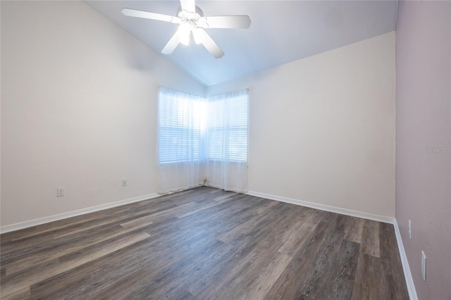 spare room with ceiling fan, dark hardwood / wood-style flooring, and lofted ceiling