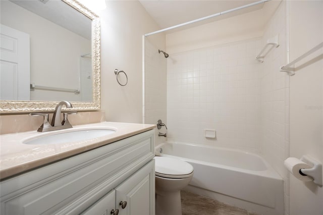 full bathroom with vanity, toilet, and tiled shower / bath combo