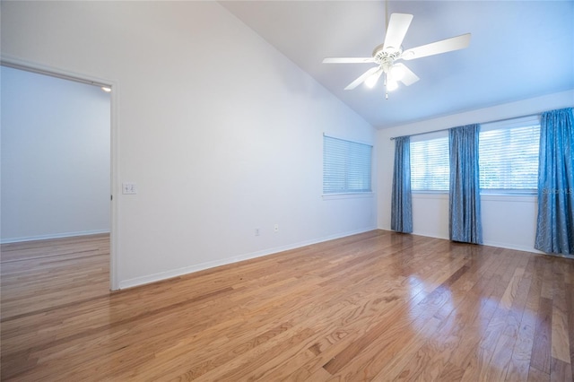 spare room featuring ceiling fan, high vaulted ceiling, and light hardwood / wood-style floors