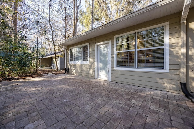 view of side of property featuring a patio area