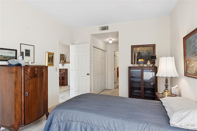 carpeted bedroom featuring a closet