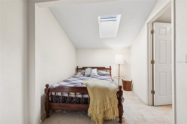 bedroom featuring light carpet and a skylight