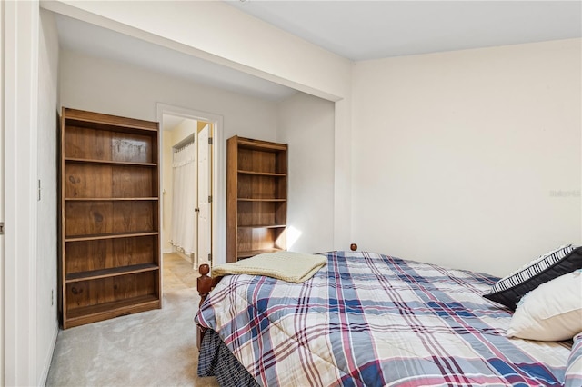 bedroom featuring light colored carpet