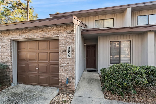 view of exterior entry featuring a garage