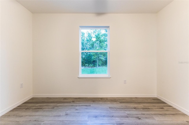 unfurnished room featuring light hardwood / wood-style flooring