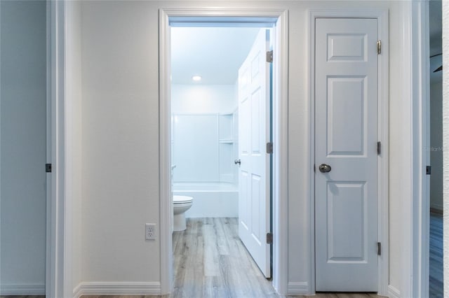 corridor featuring light hardwood / wood-style flooring