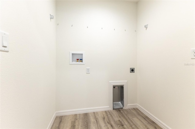 laundry room featuring hookup for a washing machine, hookup for an electric dryer, and light hardwood / wood-style floors