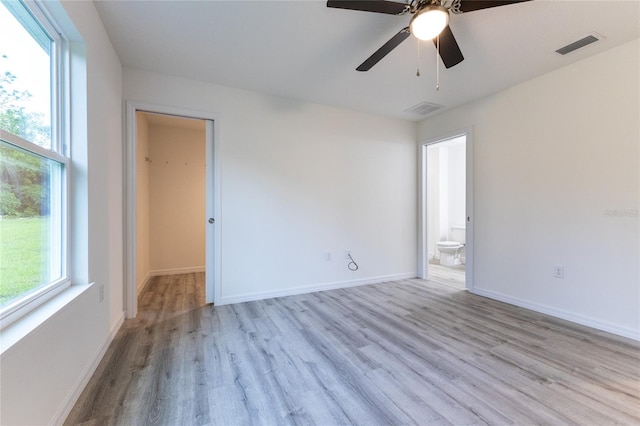 empty room featuring ceiling fan and light hardwood / wood-style floors