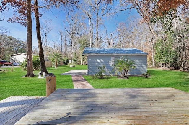 deck featuring a yard and an outbuilding