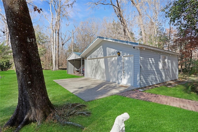 view of outbuilding with a garage and a yard
