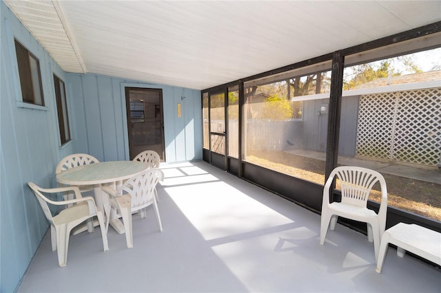 sunroom / solarium featuring a healthy amount of sunlight