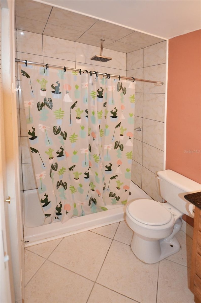 bathroom with tile patterned floors, curtained shower, and toilet